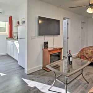 A living room with a table and a television