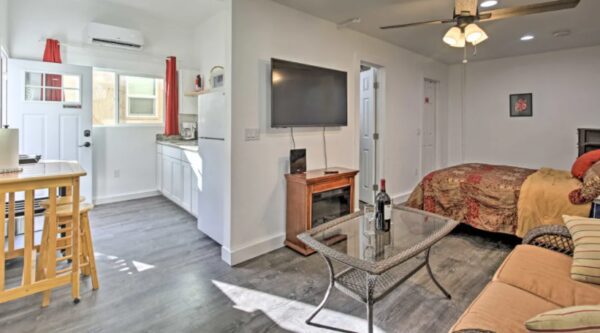 A living room with a table and a television