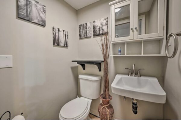 A bathroom with a toilet and sink in it