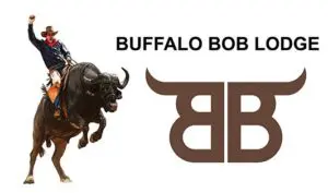 A man riding on the back of a bull.