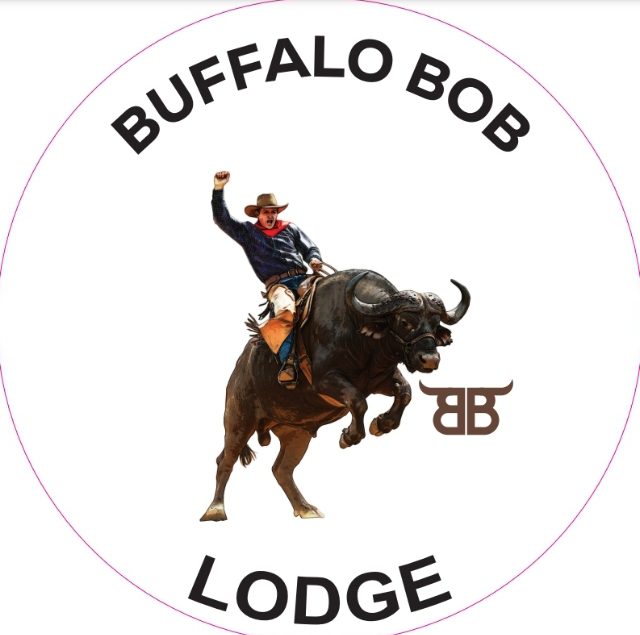 A man riding on the back of a bull.